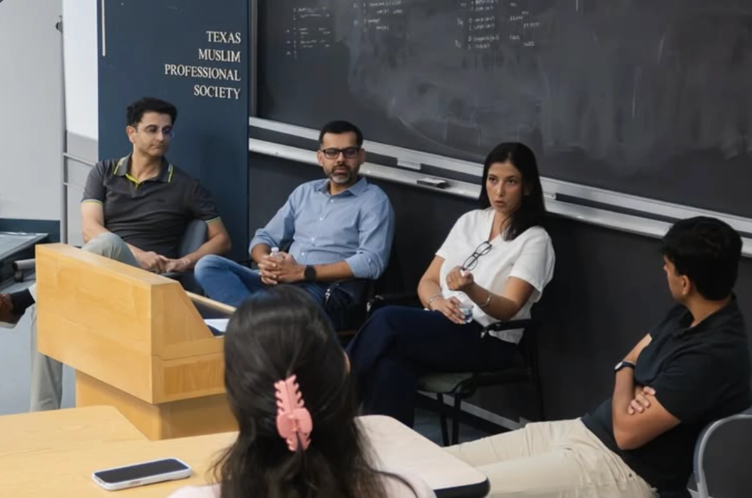 Industry panelists speaking with MPS members in a UT classroom